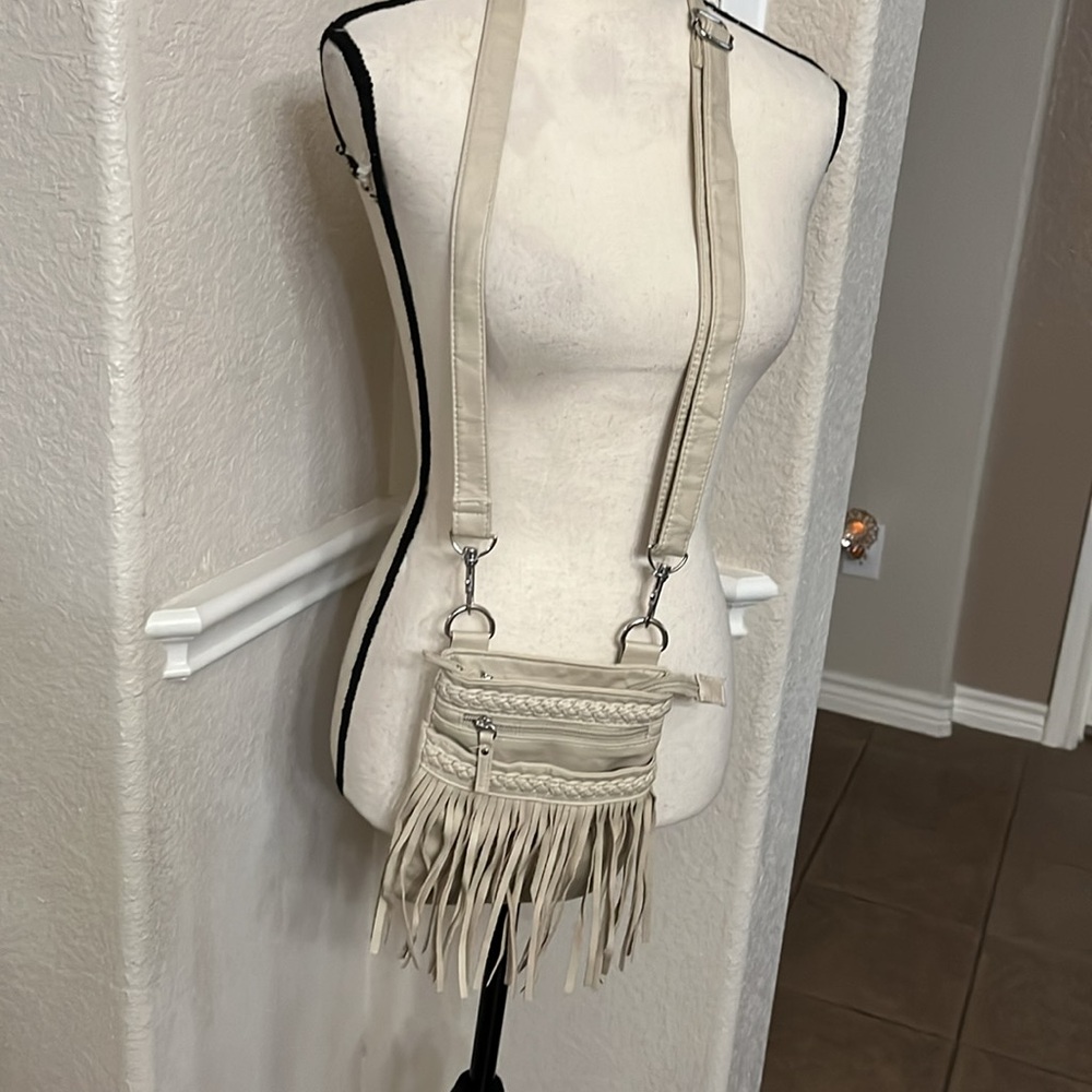 Claire’s tan fringe crossbody bag